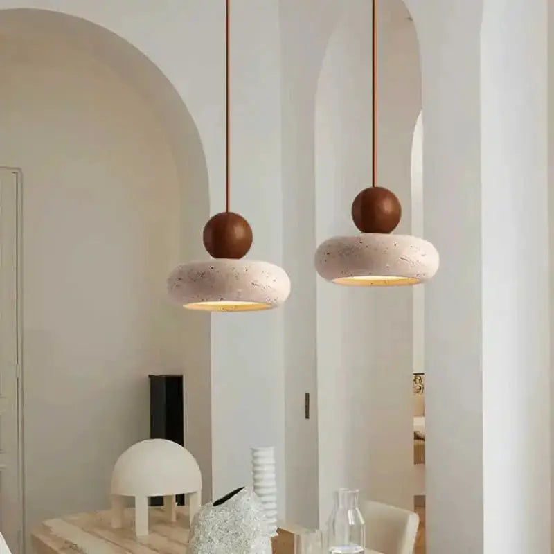 Pair of vintage pendant lights by Simples Market with white speckled donut shades and brown spheres