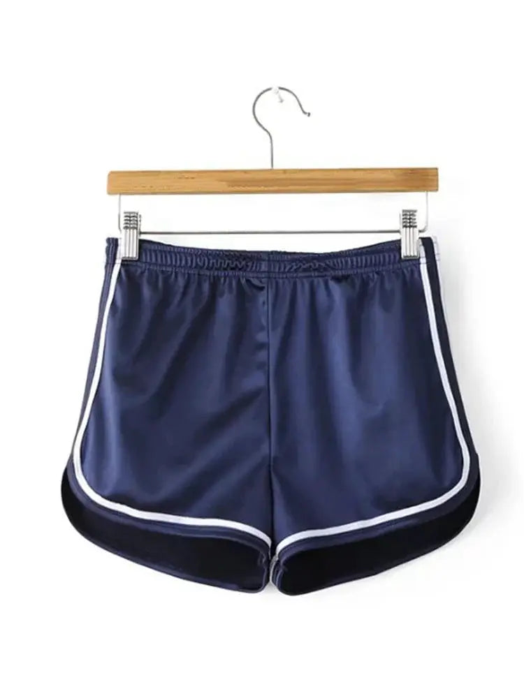 Navy silk women's shorts with white piping and elastic waistband.