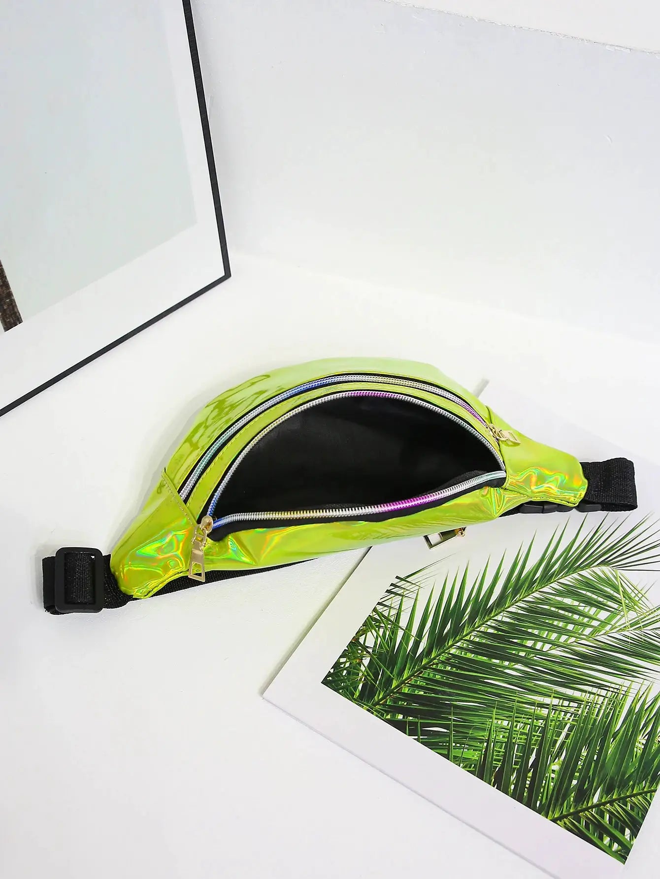 Holographic fanny pack; lime-green PU waist bag with black adjustable strap and gold zippers.