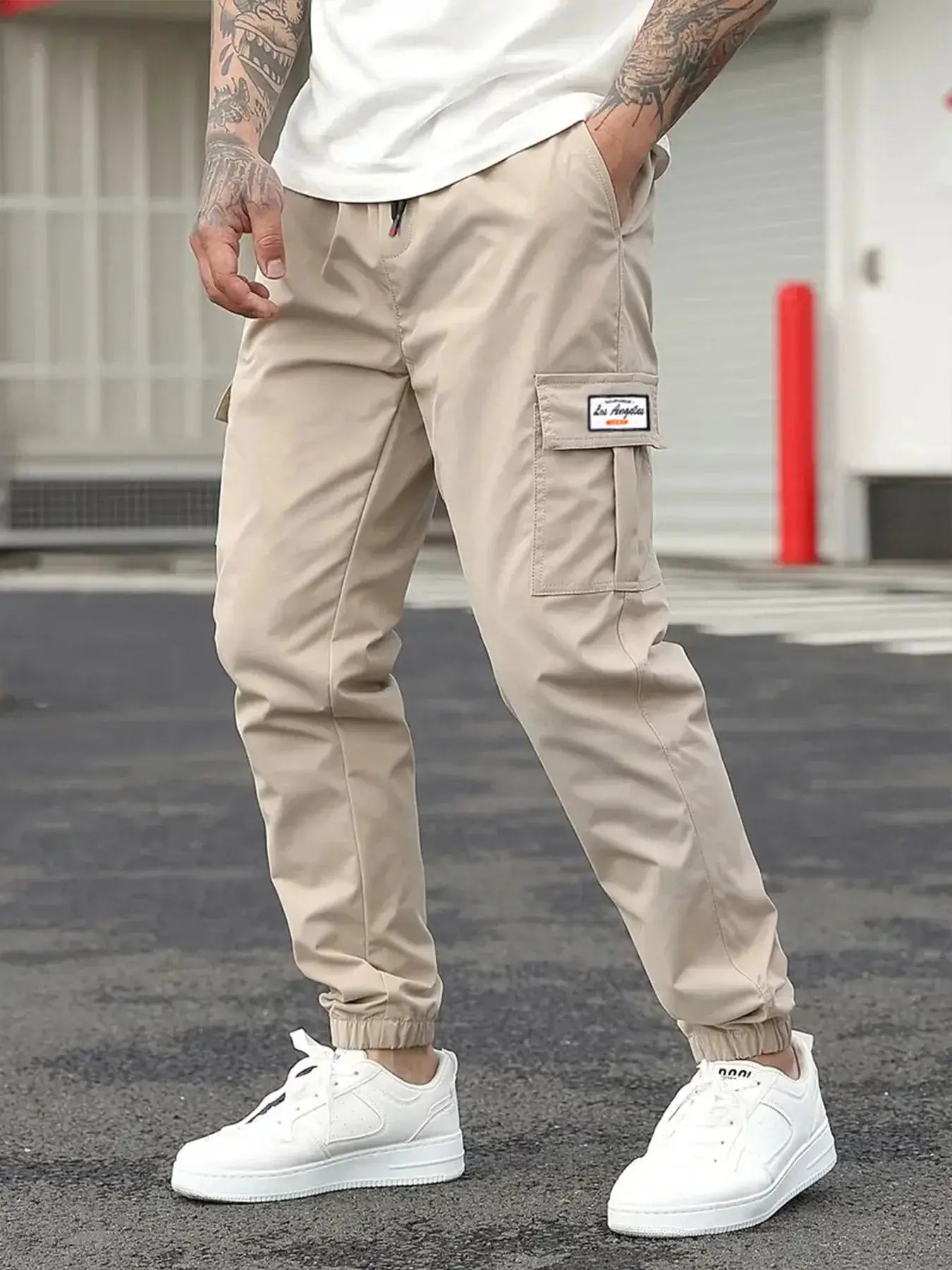 Spring men's cargo pants by Simples Market; beige jogger-style cargo pants with drawstring waist, cargo pocket and logo patch
