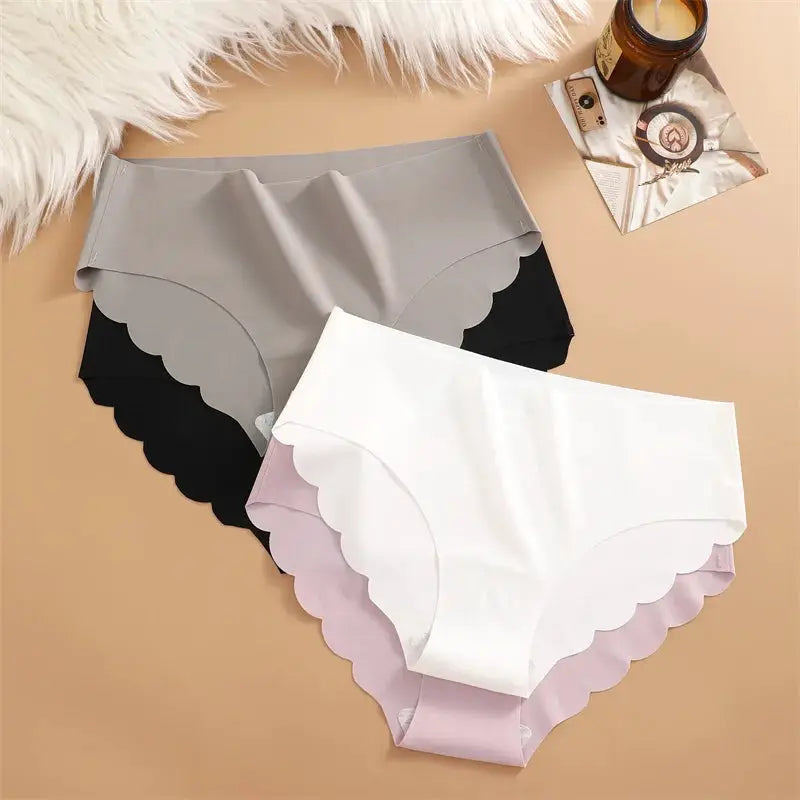 Simples Market ice silk seamless panties 4-piece set in gray, black, white, lavender with scalloped edges.