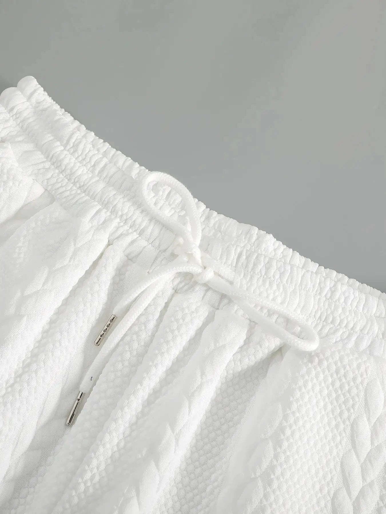 Men's white drawstring casual shorts by Simples Market; breathable textured fabric, elastic waistband, 5-inch length.