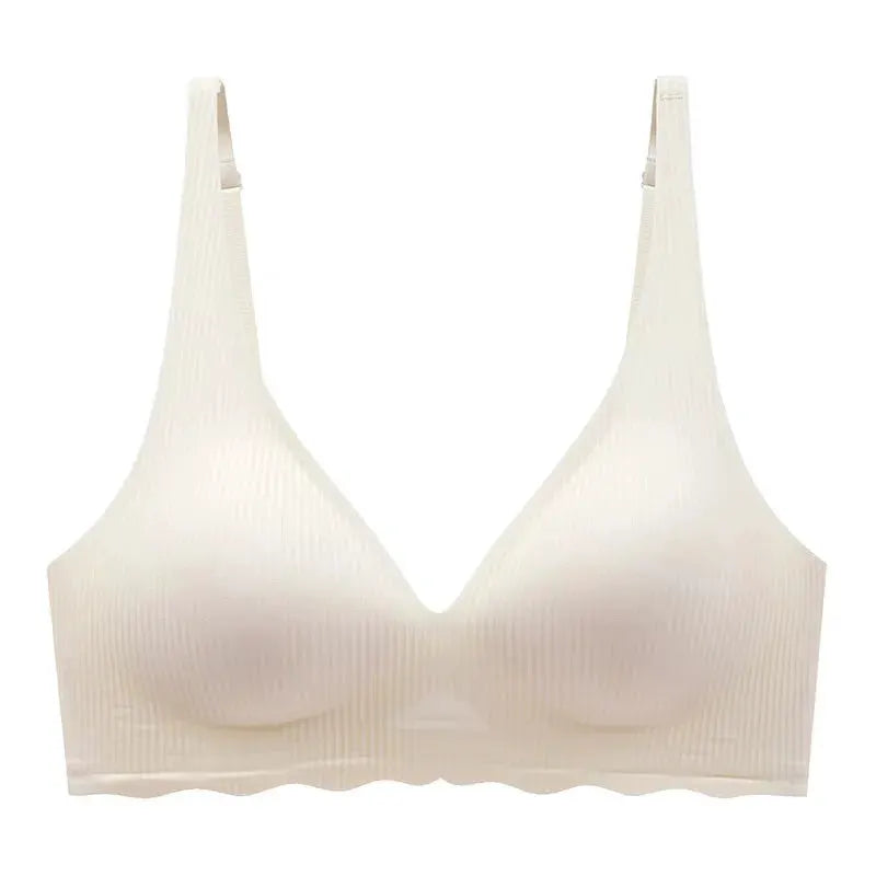 Seamless women's bra, nude striped ribbed fabric with V-neck and adjustable straps.