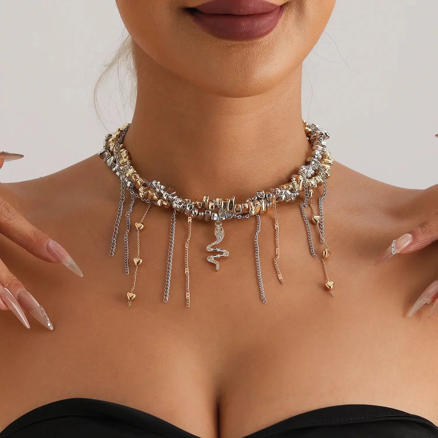 Y2K heart beaded necklace by Simples Market; two-tone gold and silver choker with dangling chains, heart and snake charms
