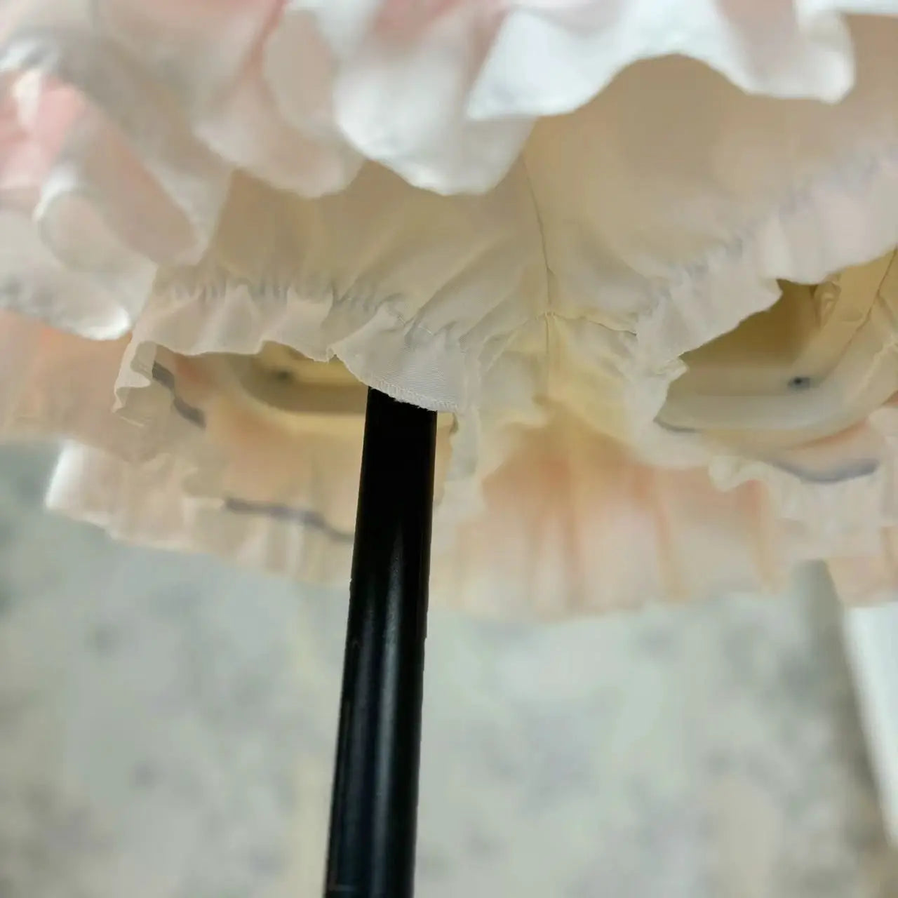 Lolita style princess cake skirt by Simples Market in cream lace with ruffle trim.