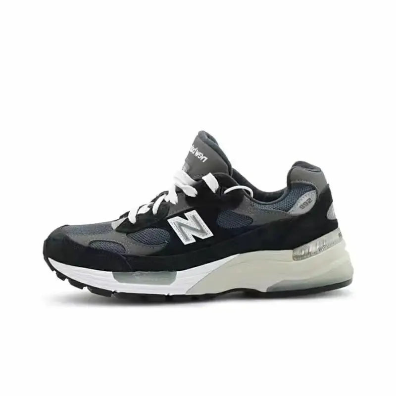 New Balance mesh running sneakers, black and gray with white sole, cushioned, anti-slip outsole