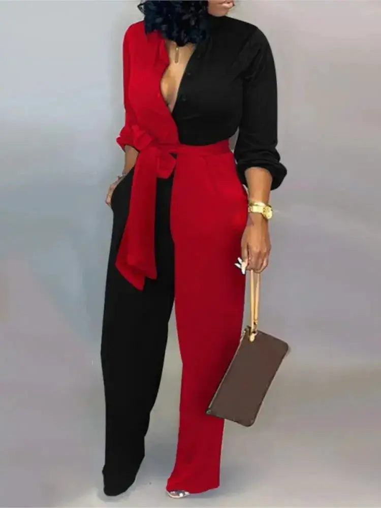 Women color-block long-sleeve jumpsuit with red and black panels and waist belt.