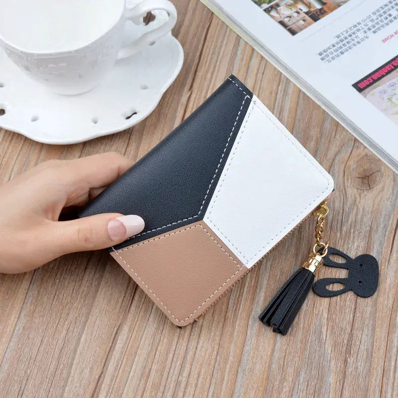 Fashion wallet clutch in black, white and beige PU leather with a tassel charm
