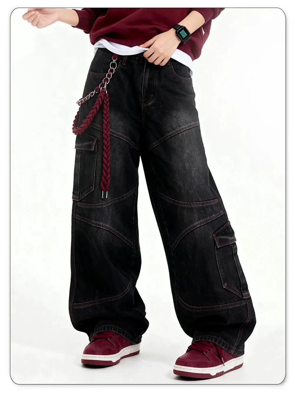 Men's wide-leg black denim cargo jeans with red contrast stitching and multiple pockets