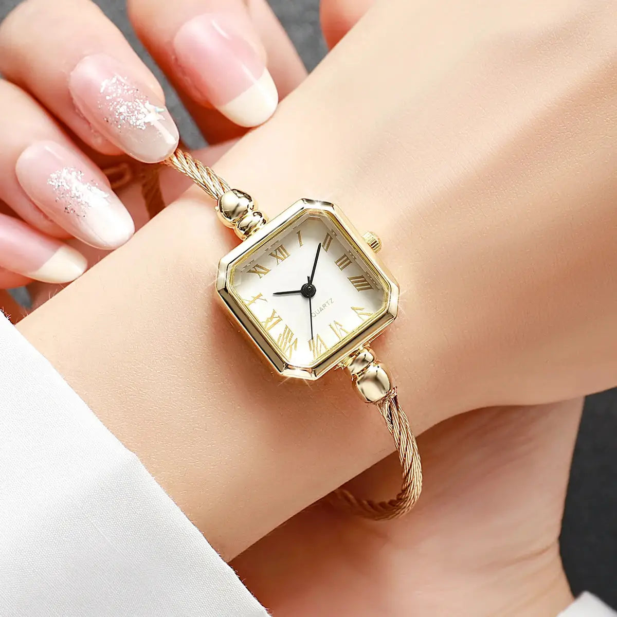 Gold-tone square Roma dial women's quartz watch with bracelet strap
