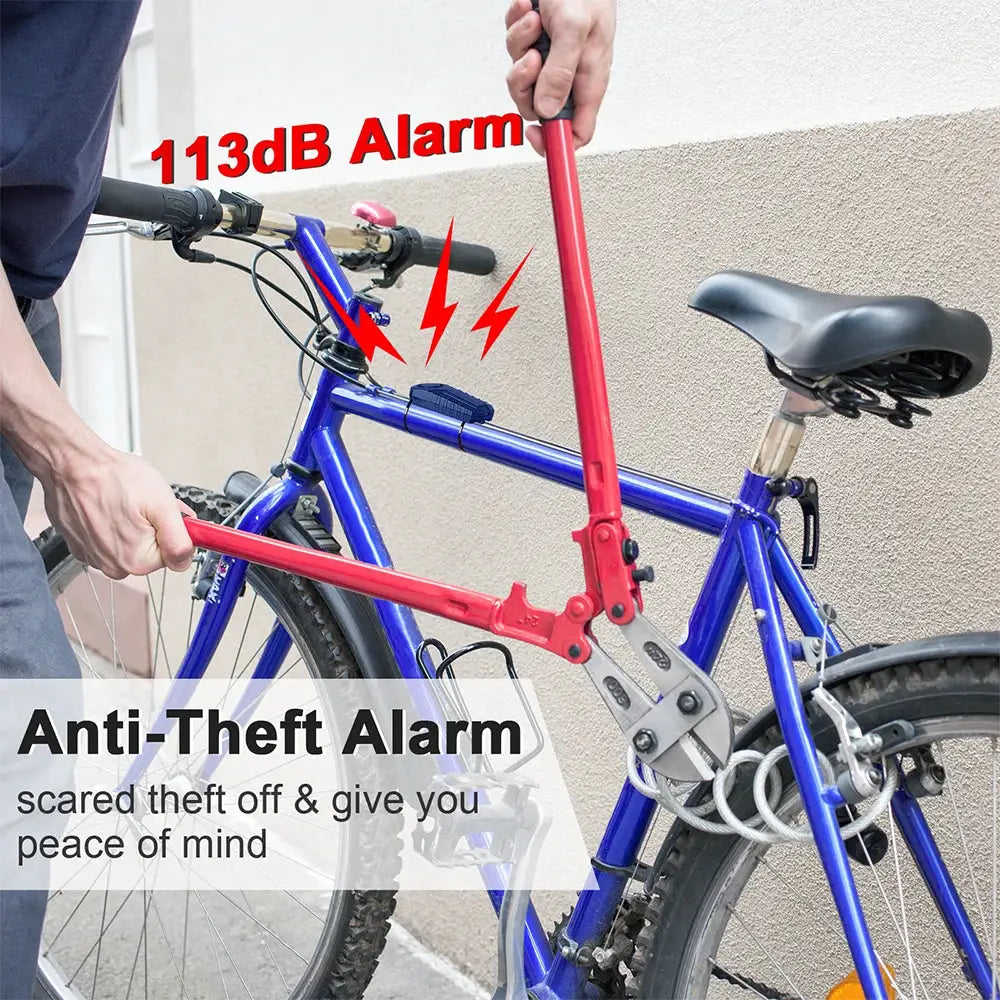 Simples Market 113dB bike anti-theft alarm with remote; red alarm device attached to blue bicycle frame.