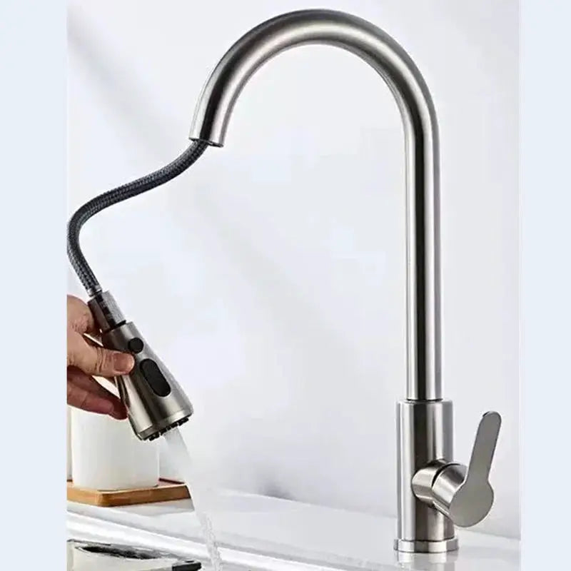 Kitchen faucet with chrome finish and black pull-out spray head.
