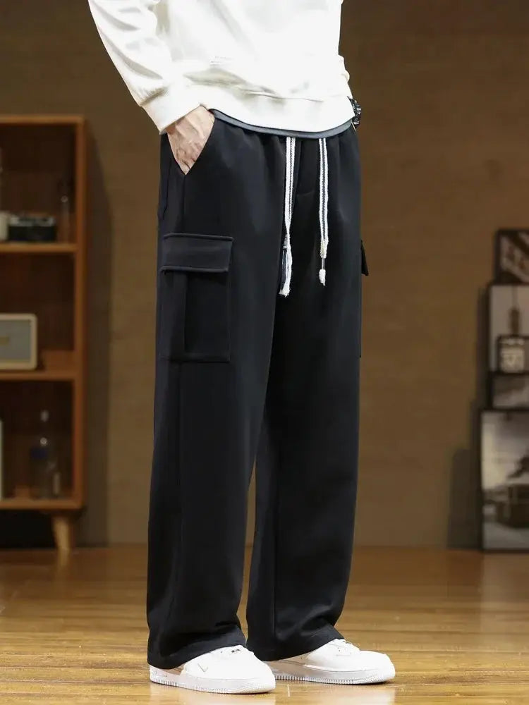 Men's cargo sweatpants with multiple pockets, black cotton, drawstring waist, wide loose fit, 8XL.