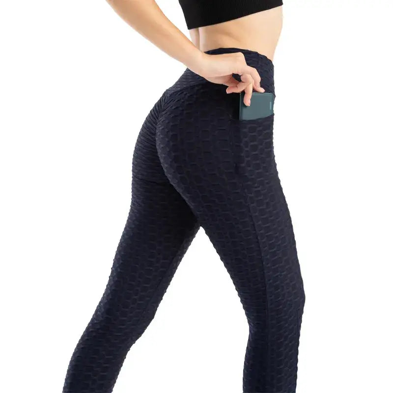 Women's navy bubble-pocket leggings with high waist and textured stretchy fabric for gym workouts