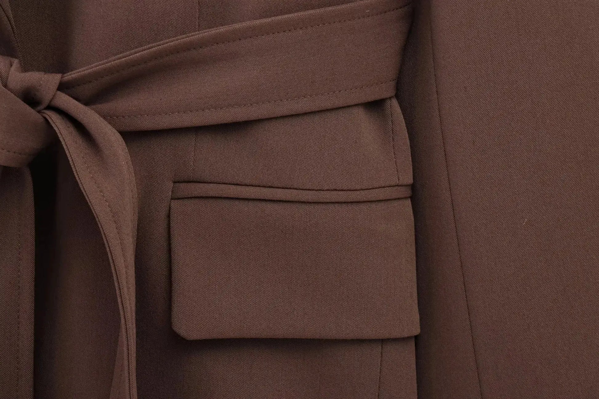 KONDALA brown blazer with tied waist sash; close-up of textured fabric