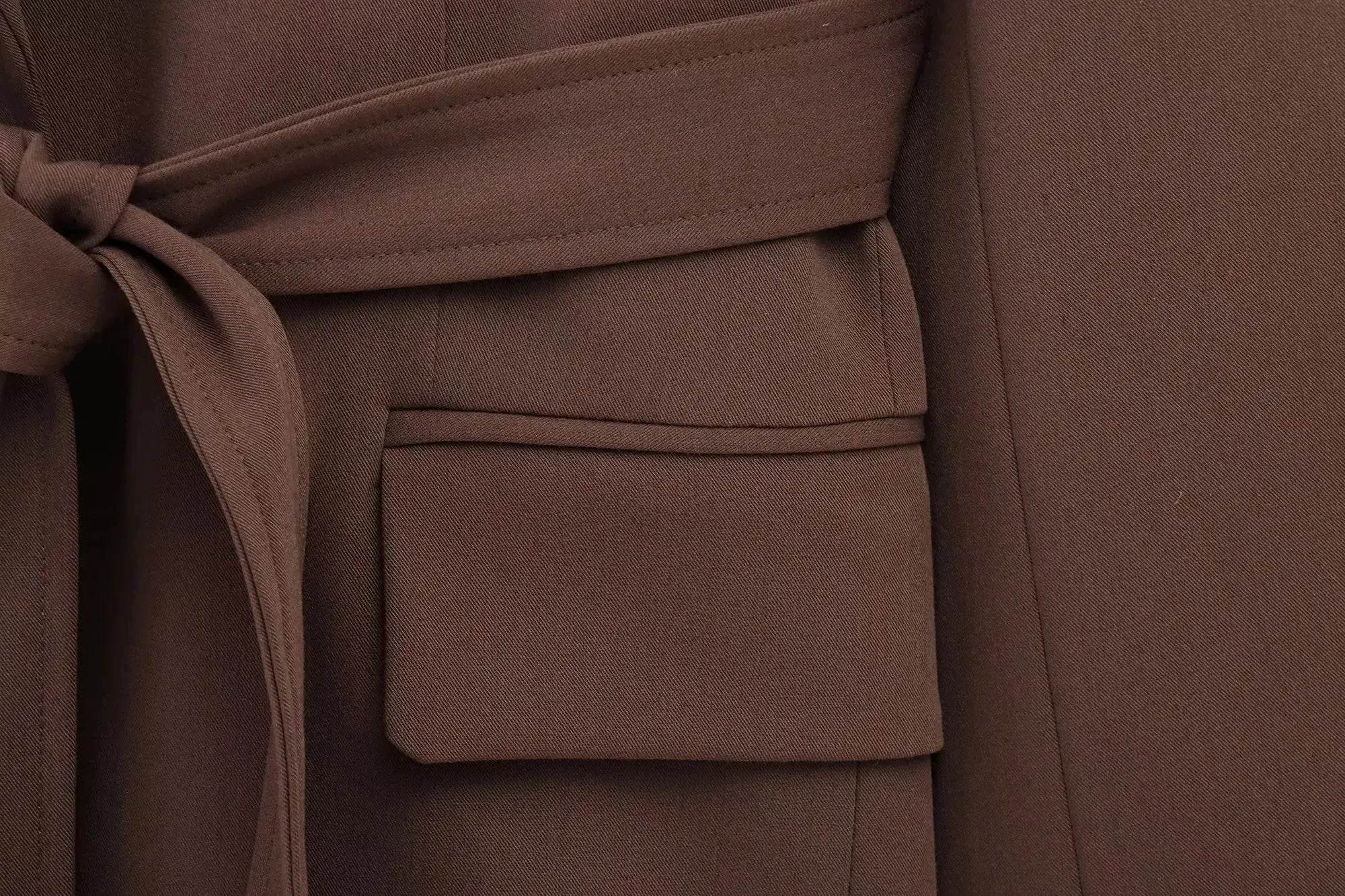 KONDALA brown blazer with tied waist sash; close-up of textured fabric