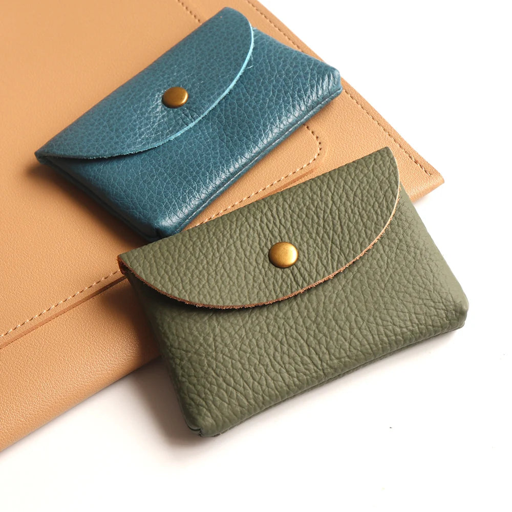 Genuine leather card holder pair in teal and olive green with brass snap closures