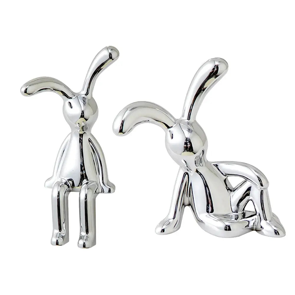 Rabbit figurine pair in chrome for car interior center console and desk decor.