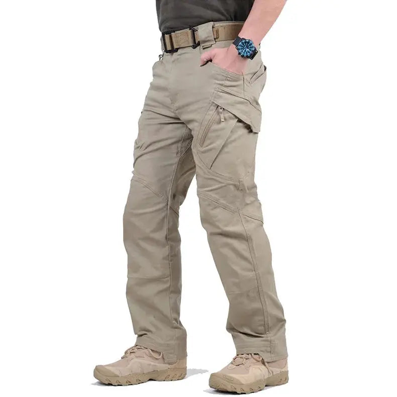 Men's tactical cargo pants in beige with multiple pockets and belt-loop waist.