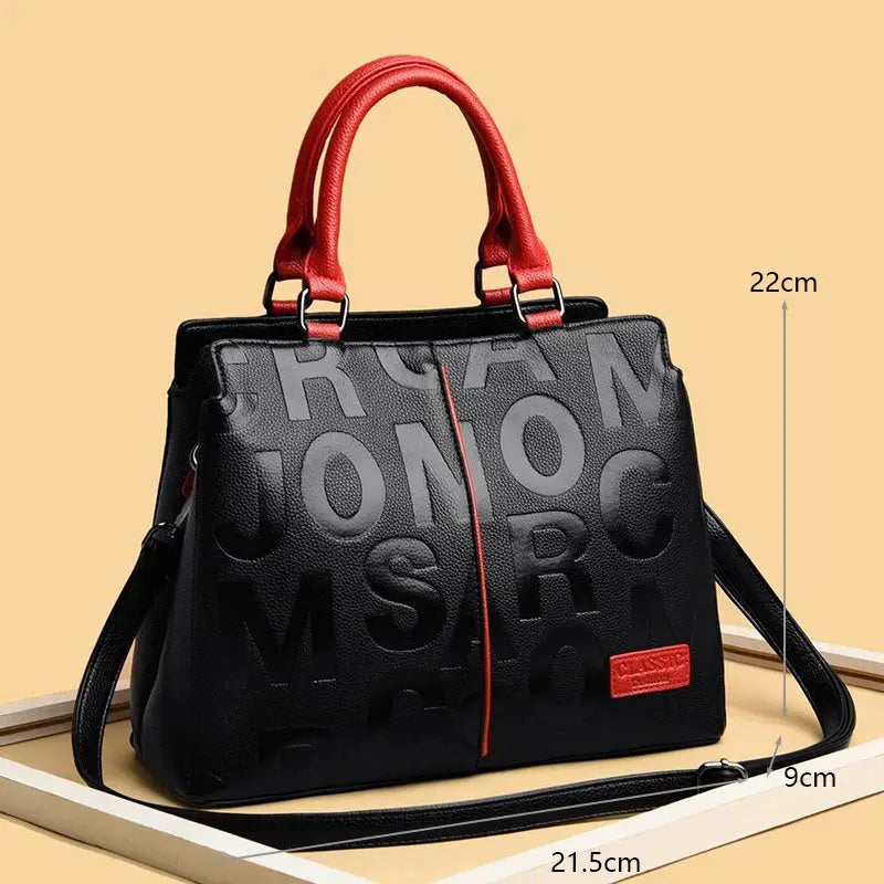 PU leather crossbody bag for women by Simples Market, black with red handles and embossed lettering