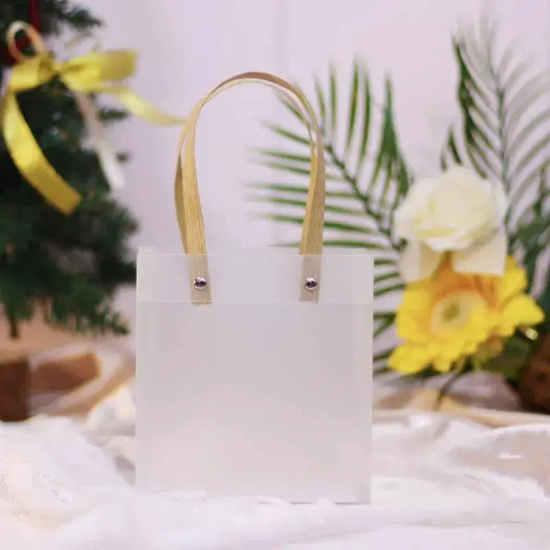 Frosted white tote gift bag with tan handles, eco-friendly holiday gift packaging