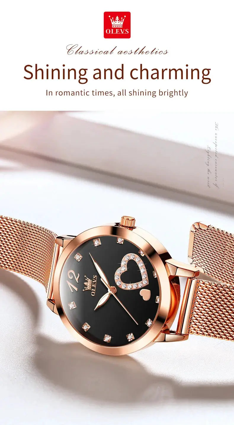 OLEVS women's quartz wristwatch with rose-gold stainless steel mesh strap and black dial featuring a crystal heart motif