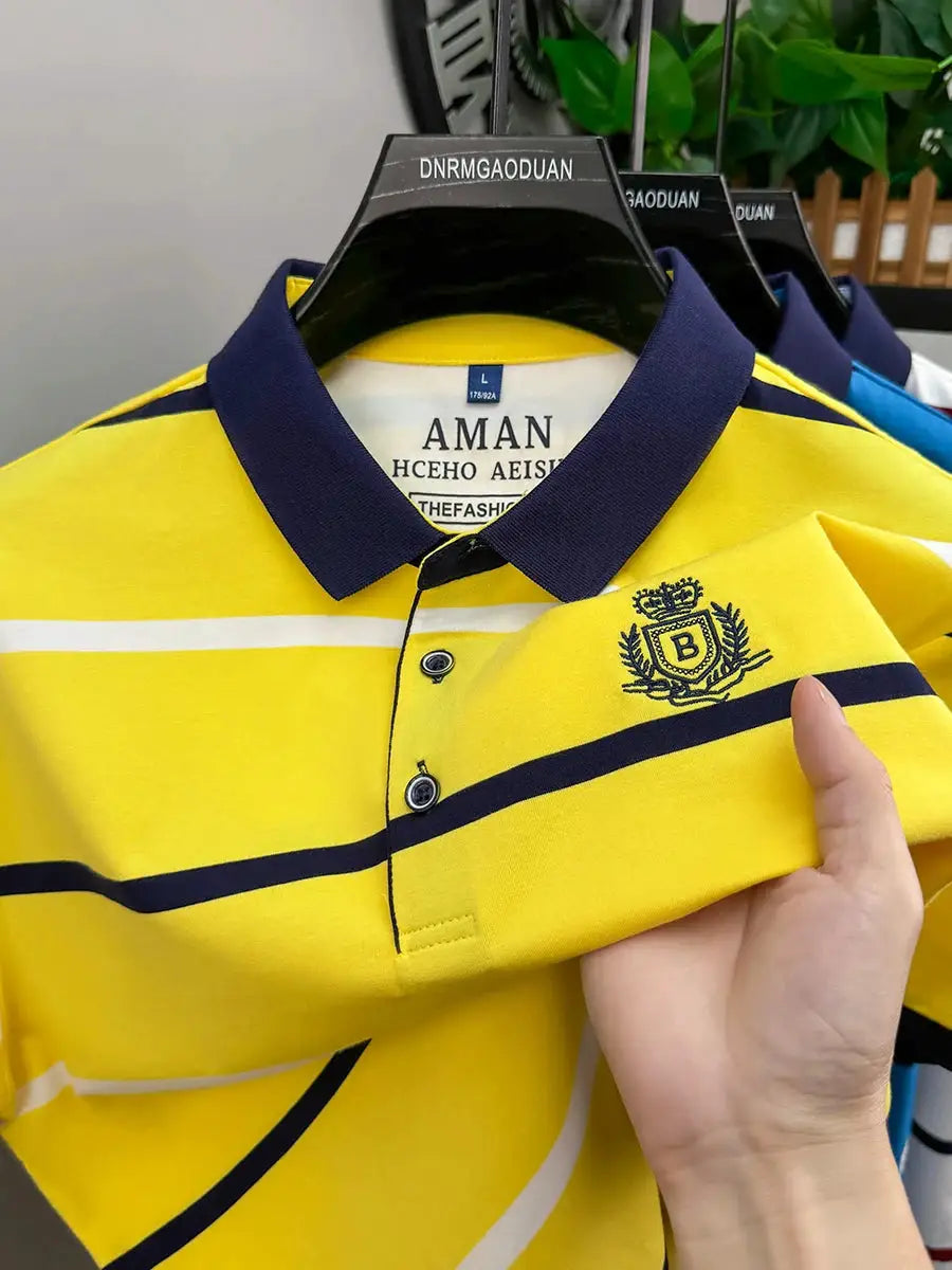 Simples Market men's yellow striped polo shirt with navy collar and crest embroidery.