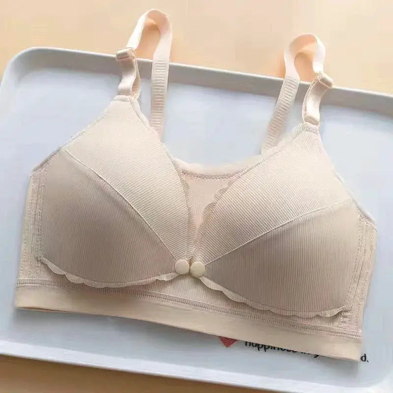 Beige wireless bra with padded cups, scalloped edge trim, and adjustable straps