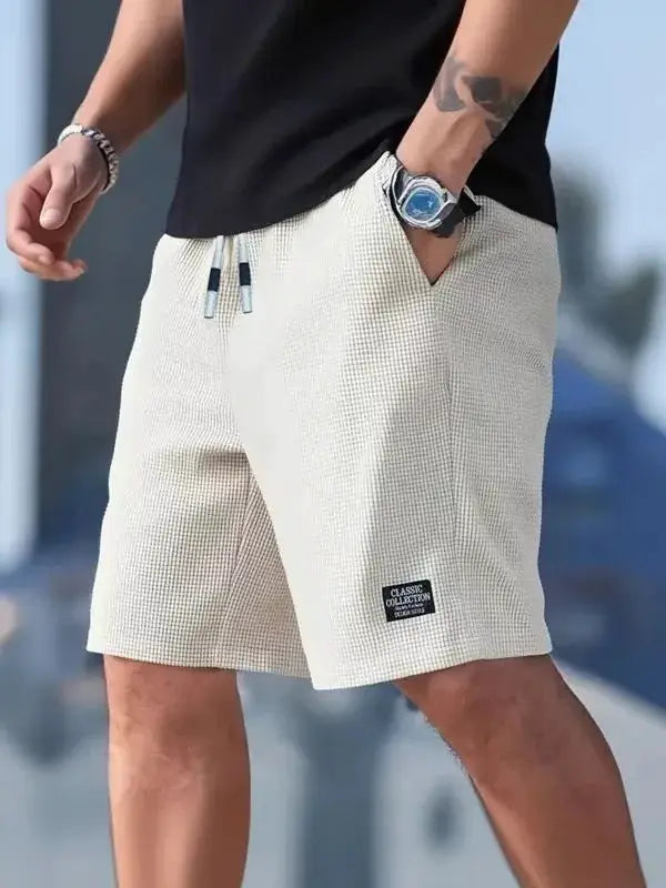 Men's shorts by Simples Market; beige textured casual beach shorts with a drawstring