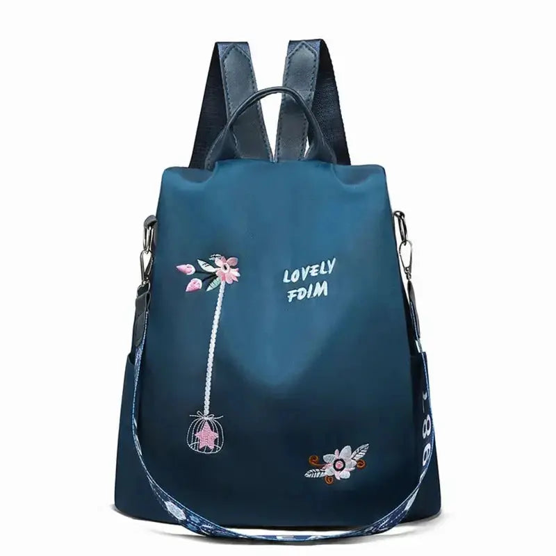 Waterproof Oxford women backpack in blue with pink floral embroidery, anti-theft design, large-capacity travel bag
