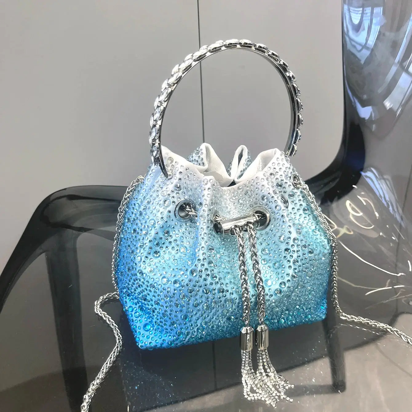 Rhinestone evening bucket bag blue by Simples Market with circular crystal handle and silver chain