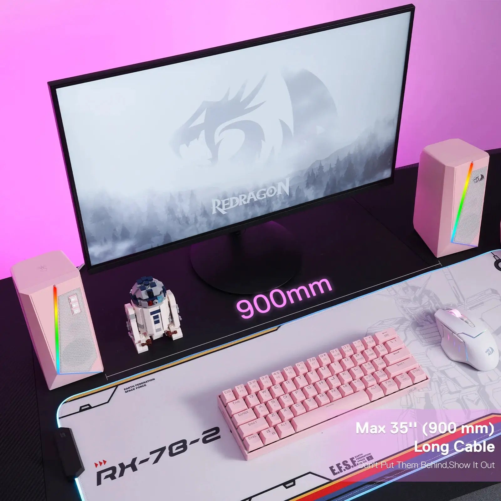 Redragon GS520 RGB desktop speaker pair in white with multicolor LED lighting on a pink-lit desk setup