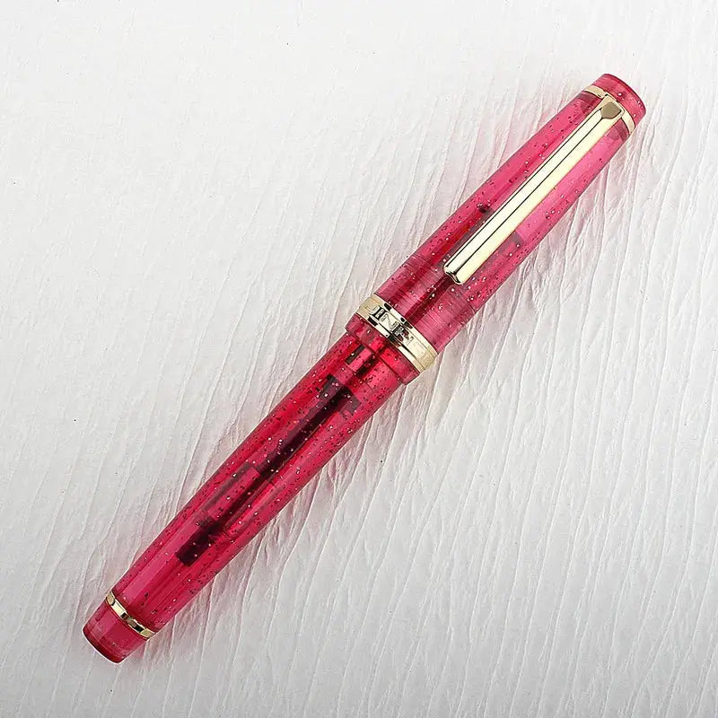 Jinhao 82 fountain pen in pink translucent acrylic with gold trim and clip, converter included