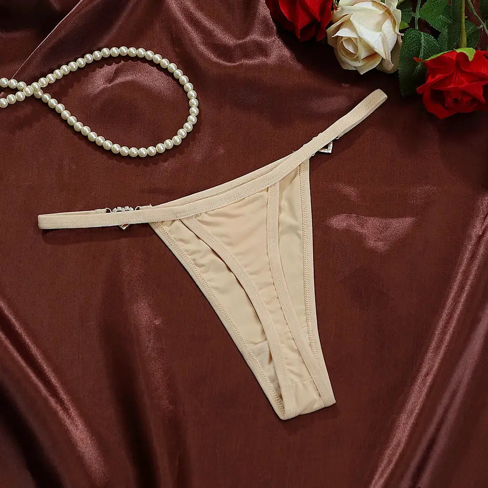 Beige cotton thong, low-rise G-string with heart charm.