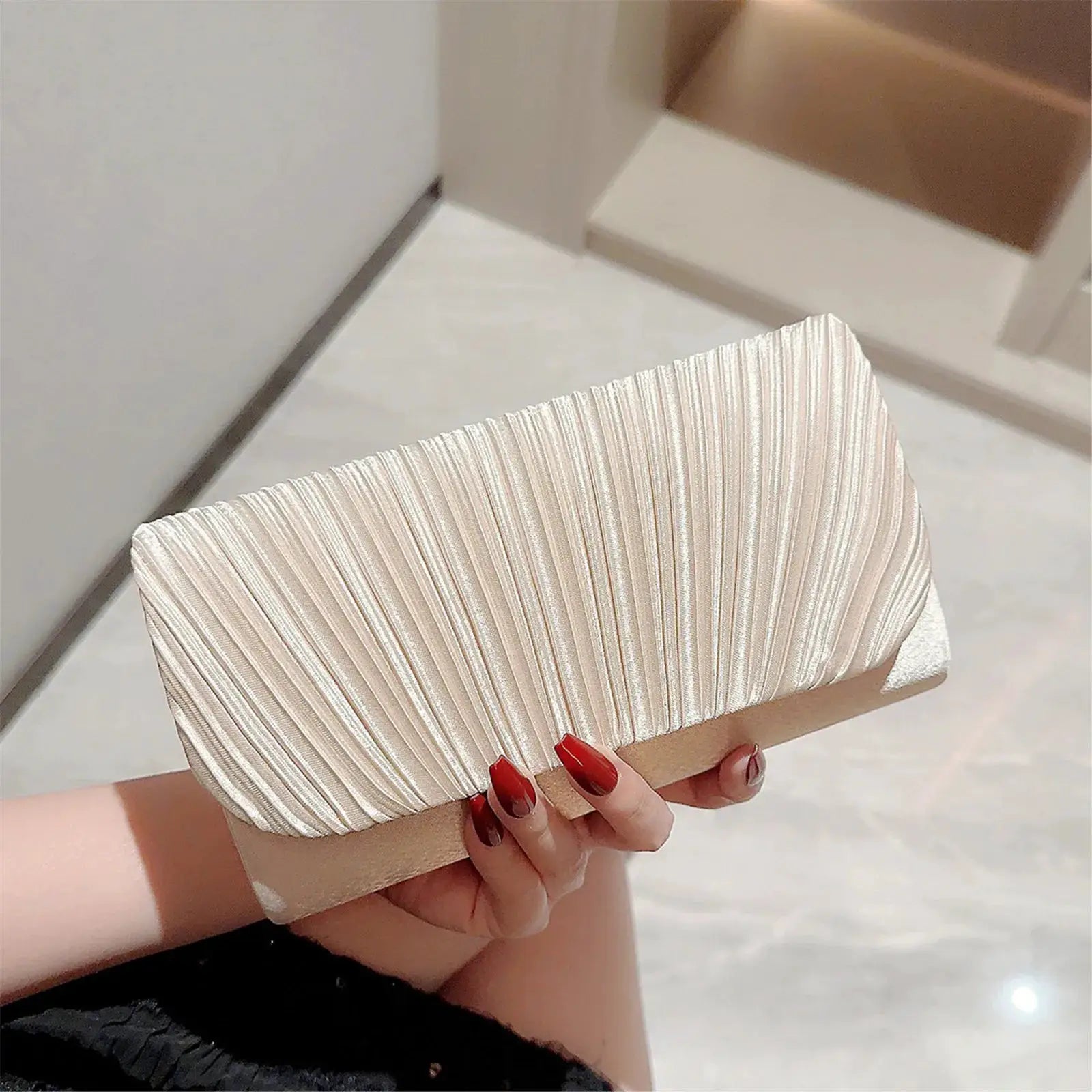 Women's pleated silver evening clutch with chain shoulder strap