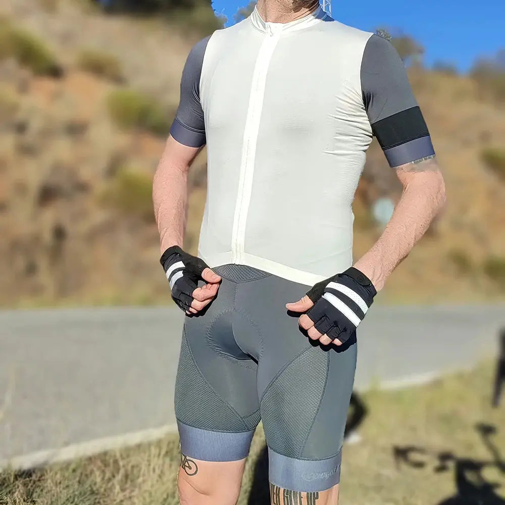Men's cycling bib shorts with sponge padding, grey panel design for road and MTB riding.
