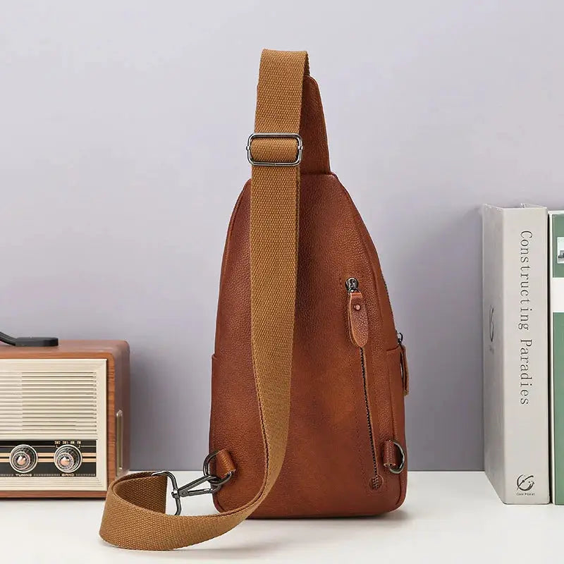Leather chest bag in brown genuine top-grain leather with tan adjustable strap