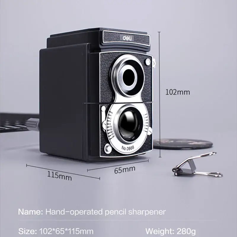 Deli camera-style rotary pencil sharpener, black plastic body with chrome dials.