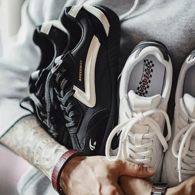 Maden unisex racing sneakers, black patchwork with beige overlays, Speedway logo; white lace-up trainer, two shoes.