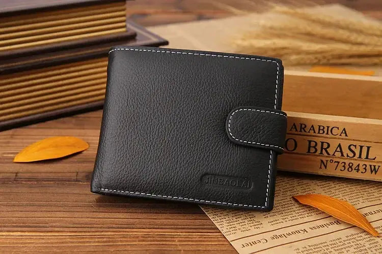 Men's black genuine leather wallet with strap closure and white stitching