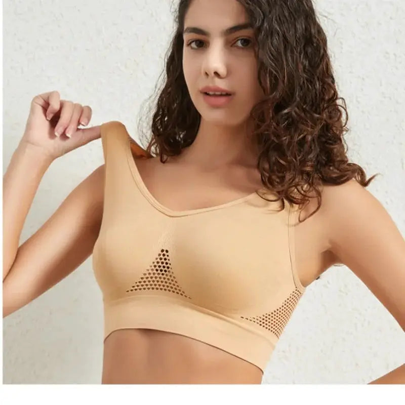 Women's plus-size seamless breathable mesh sports bra in beige, non-wire crop top with triangle mesh panels
