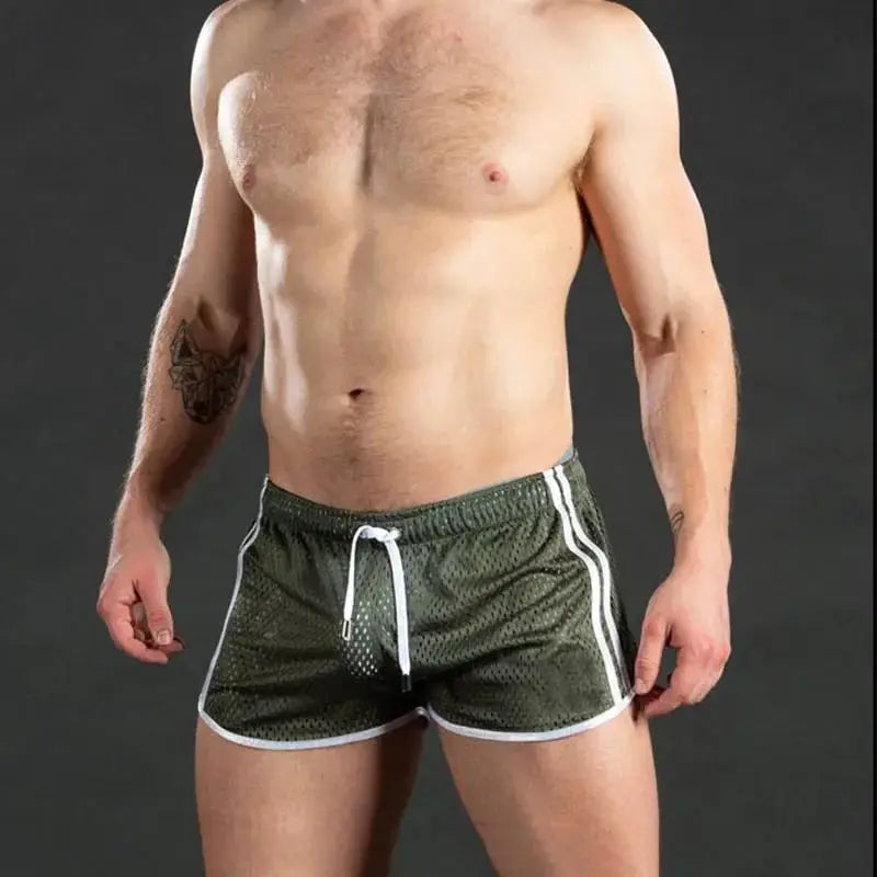 Men's green mesh gym shorts with white trim and drawstring, quick-dry running shorts