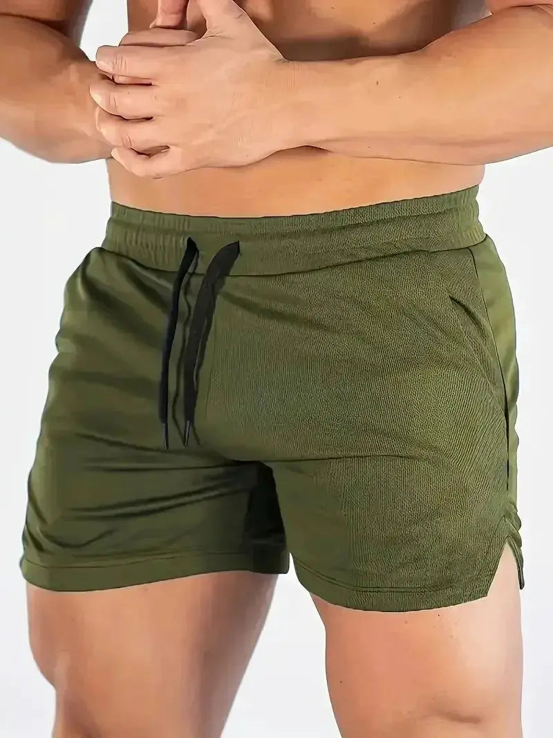 Men's olive green fitness shorts with black drawstring and elastic waistband for running and hiking