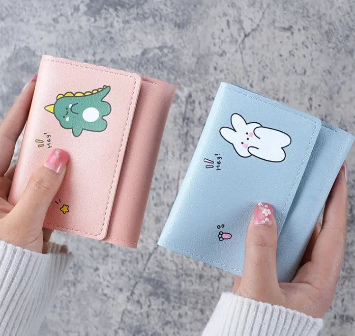 Women’s cartoon wallets in pink and blue, two pastel wallets with cute character designs