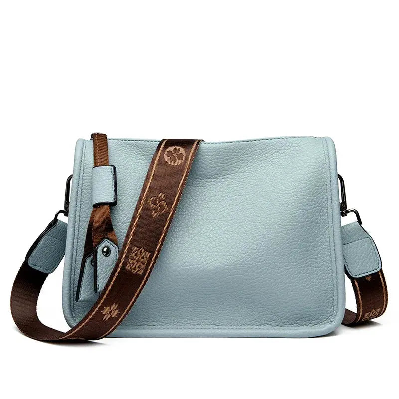 Light blue genuine leather women's tote bag with brown logo-printed crossbody strap