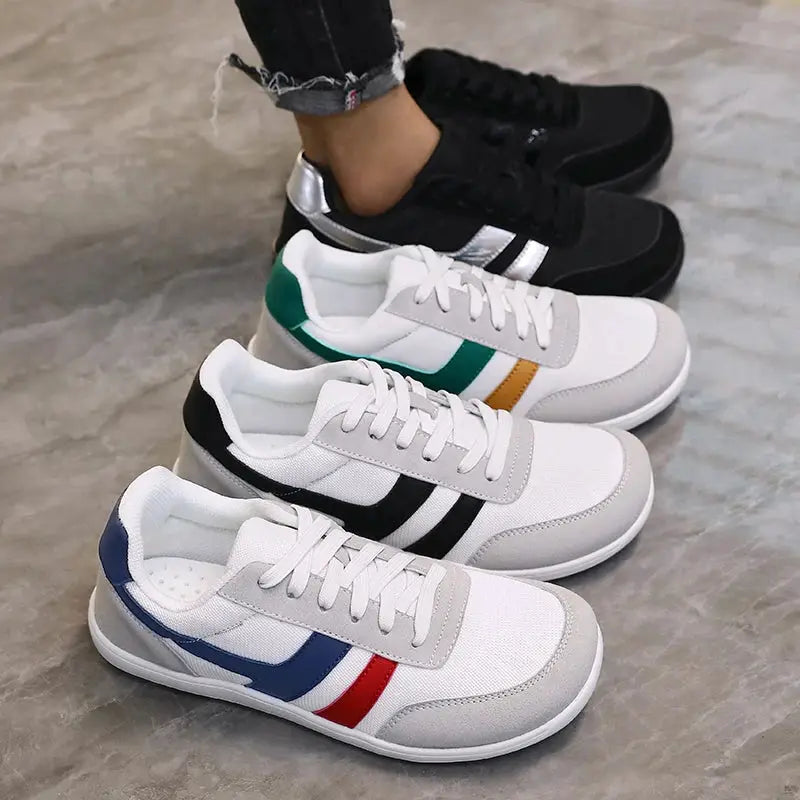 Running shoes: five pairs of wide anti-slip lightweight sneakers in varied colors with side stripes.