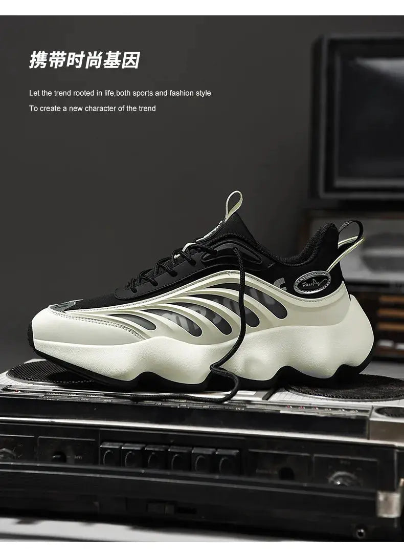 Men's sneakers with black upper, cream chunky sole, and wavy side overlays