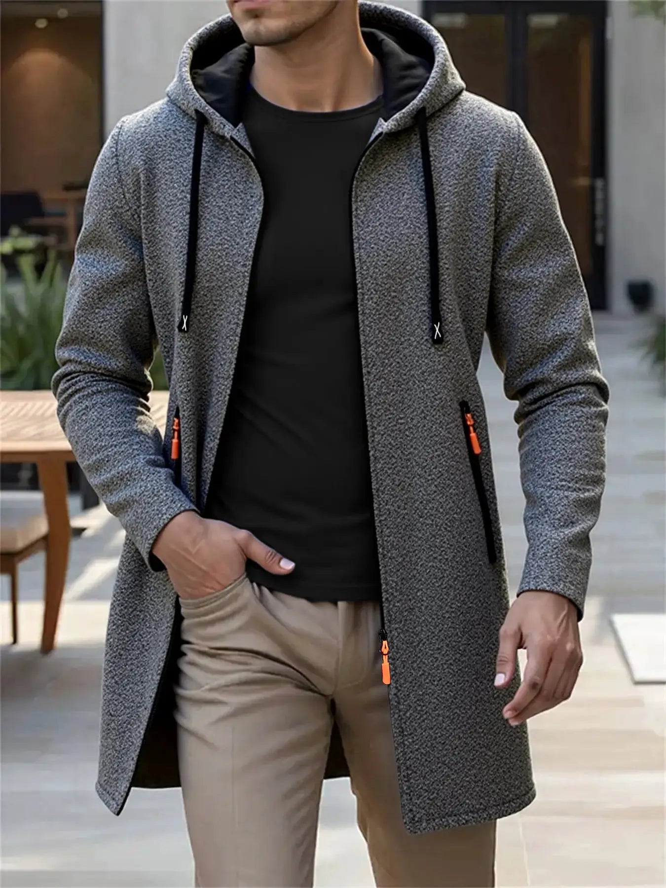 Men's hooded knit long coat in heather-gray with black lining and orange zipper pulls