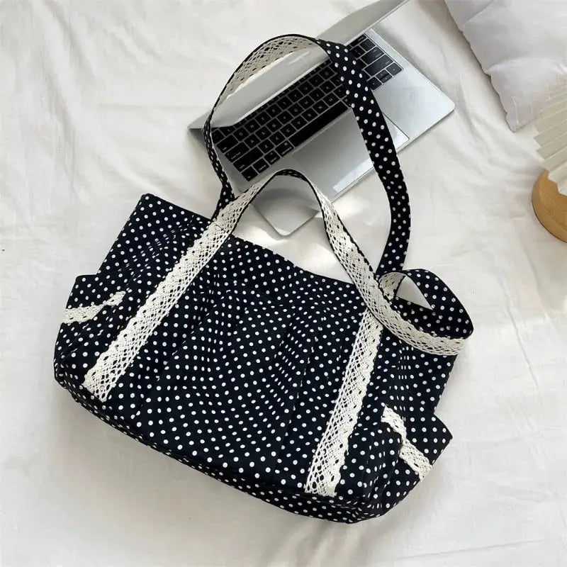 Korean vintage canvas shoulder bag with navy polka dots and white lace trim, large-capacity multi-pocket tote.