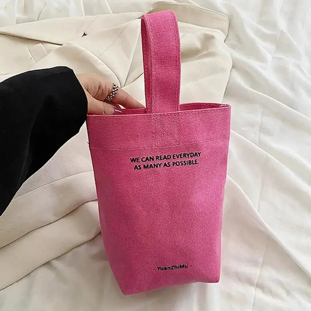 Pink canvas crossbody bag by Simples Market; casual large-capacity shopper tote with short handle